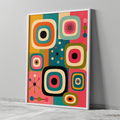 Mid century modern atomic age graphic wall art print featuring retro television shapes, starburst motifs, and geometric lines. The color palette features vibrant pink, turquoise teal, bright orange, olive green, mustard yellow, and black.