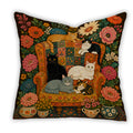 Floral folk art cat throw pillow with cats on a vintage armchair surrounded by colourful flowers