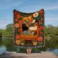 Floral cat woven throw blanket with six cats on a patterned armchair surrounded by flowers
