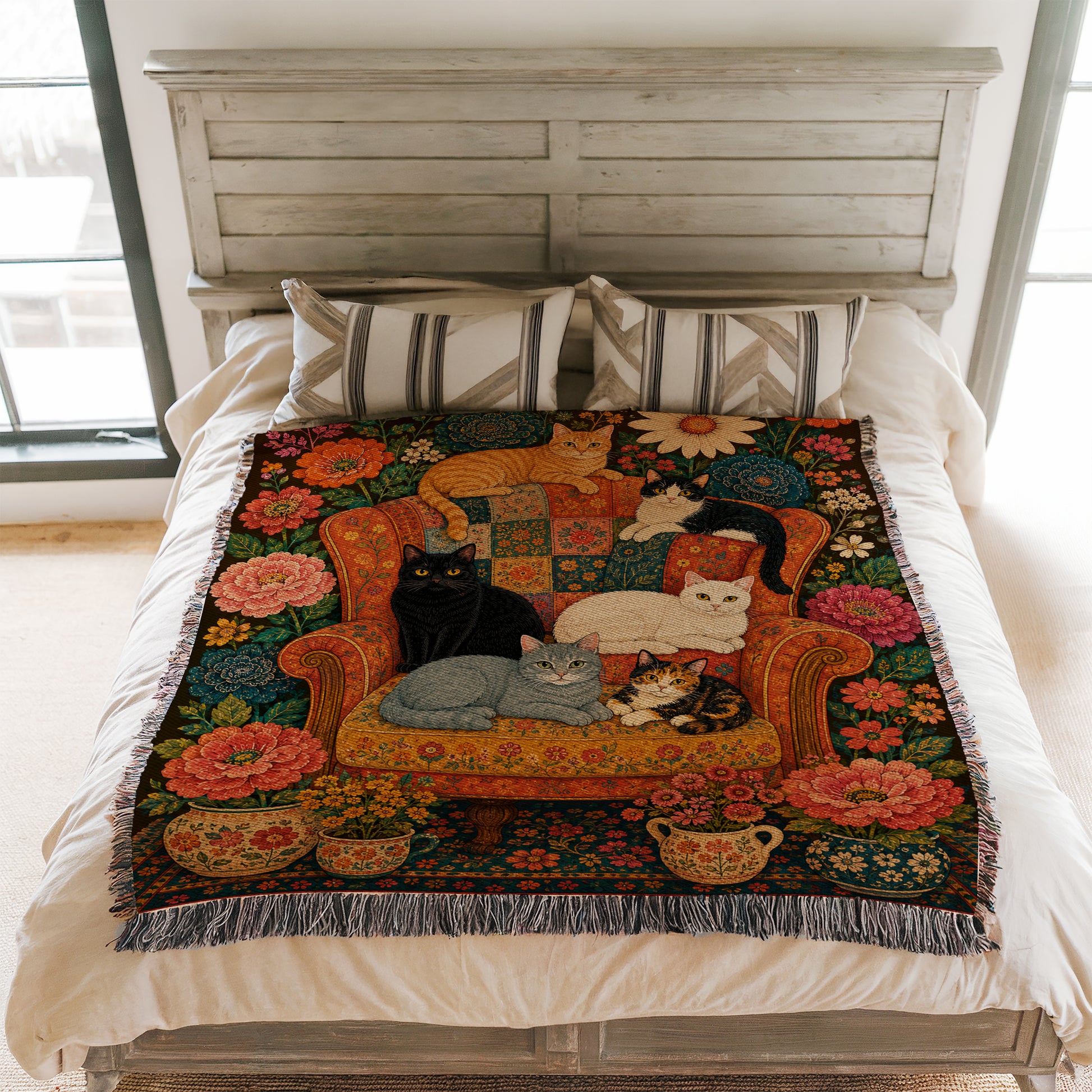 Floral cat woven throw blanket with six cats on a patterned armchair surrounded by flowers
