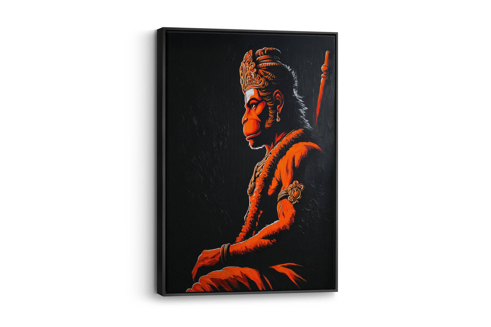 A framed vertical canvas art print depicting Hanuman in profile, illuminated in glowing orange-red tones against a dark background, shown hanging on a light gray wall.