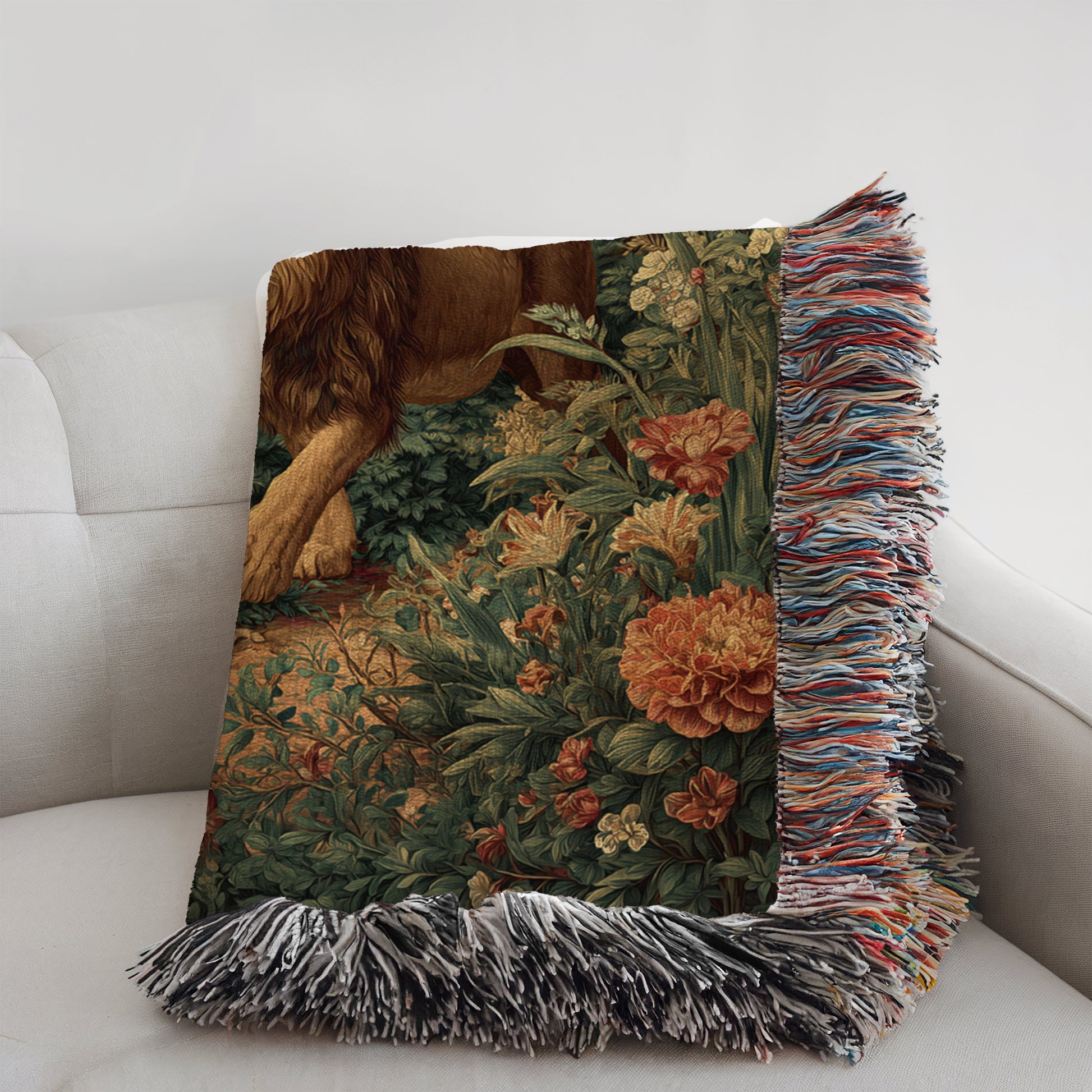 Decorative pillow with floral pattern and fringes on a white couch