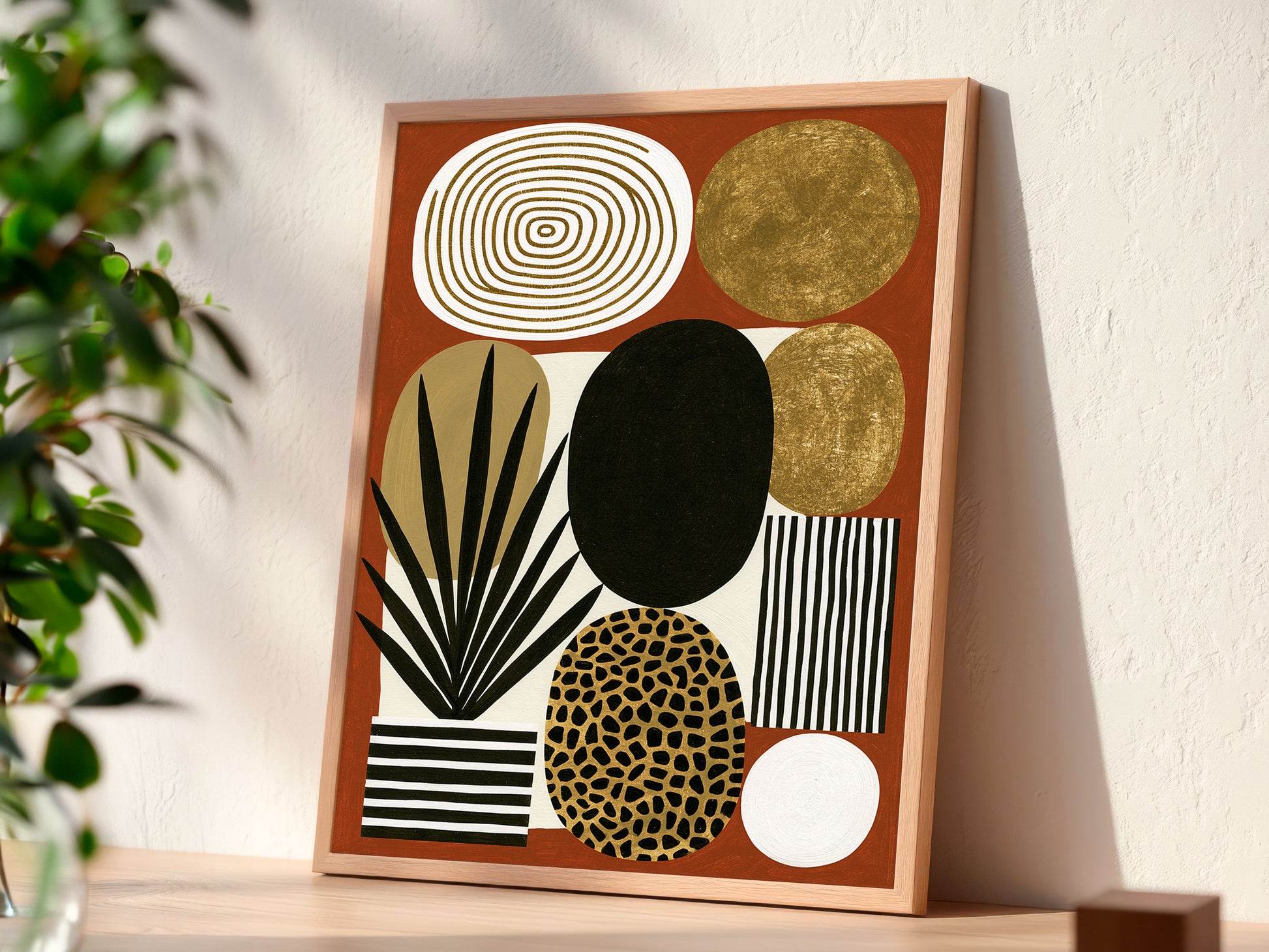 Mid century modern boho abstract art print featuring a geometric arrangement of organic shapes on a terracotta rust background. Graphic elements include a black palm plant in a striped pot, a gold leopard print oval, metallic gold circles, a black and white striped rectangle, and an off-white oval with concentric gold rings.
