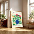 Matisse floral cut out print with pink flowers, green leaves and blue vase
