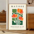 Matisse tulip print with orange tulips and green botanical leaves Framed Matisse poster with orange flowers and green leaves on a beige background