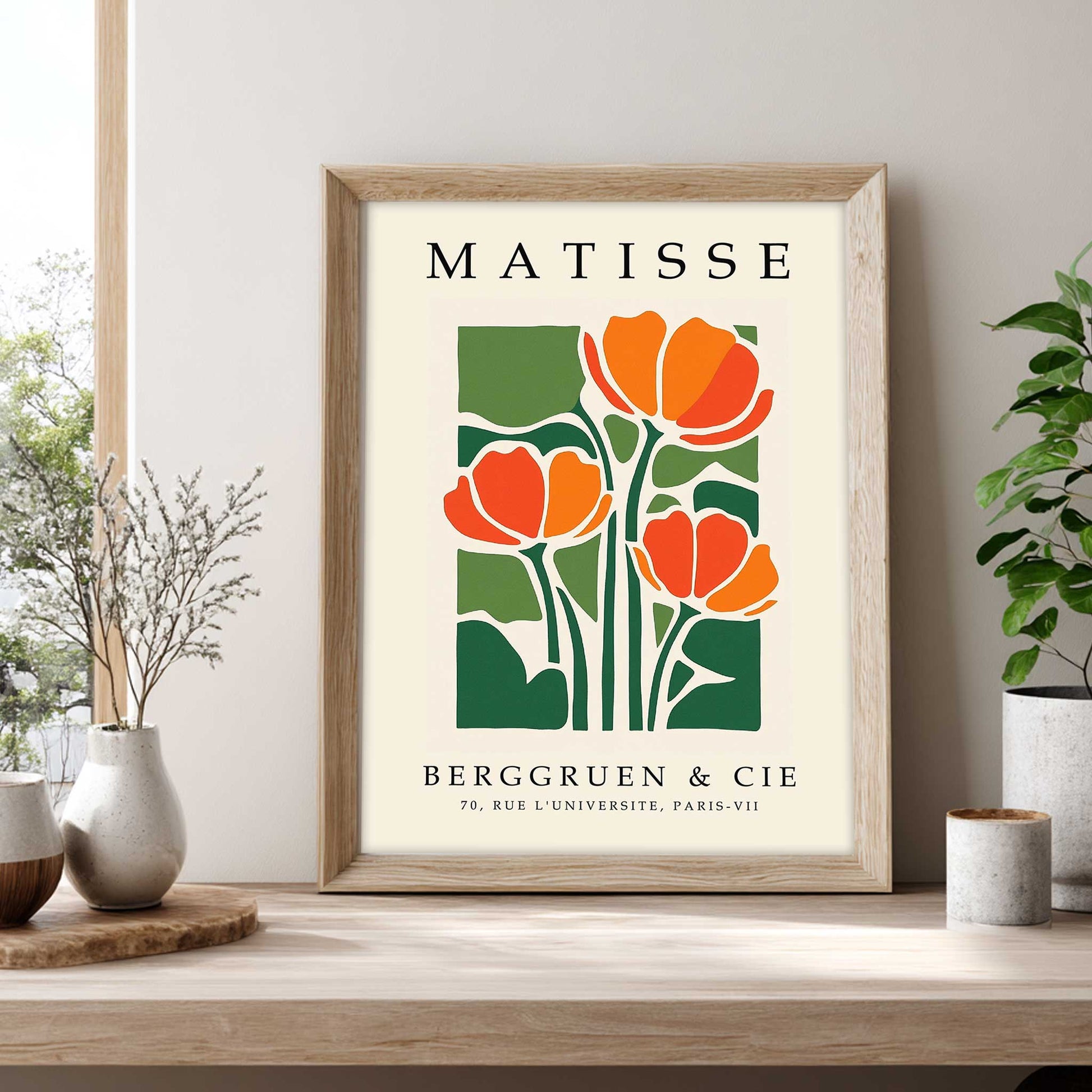 Matisse tulip print with orange tulips and green botanical leaves Framed Matisse poster with orange flowers and green leaves on a beige background