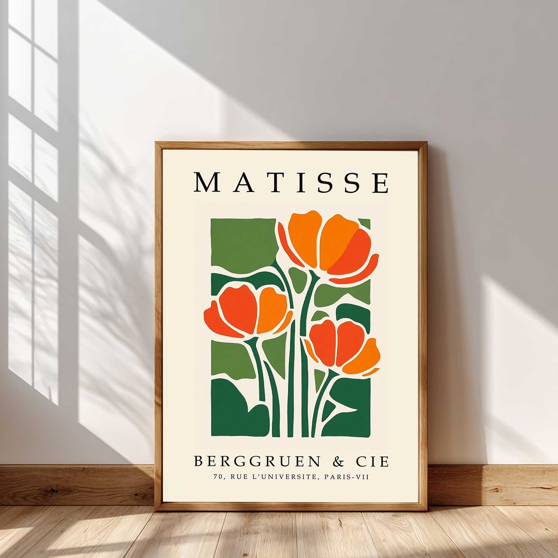 Matisse tulip print with orange tulips and green botanical leaves Framed Matisse poster with orange flowers and green leaves on a beige background