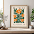 Matisse flower print with orange flowers and green botanical leaves. Botanical wall art, floral wall art, Matisse wall art, Henri Matisse print, botanical print and mid century wall art.