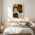 Mid century modern boho abstract art print featuring a grid arrangement of six organic, rounded geometric shapes on a terracotta rust background. Graphic textures include gold foil arches, a black spiral circle, a white concentric spiral, a gold circle with a black leaf sprig, a black oval with a white palm frond, and a dark brown oval covered in gold dots.