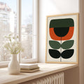 Geometric Scandi botanical print featuring a minimalist stylized flower stem in burnt orange, forest green, and black on a cream background.