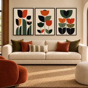  70s retro tulip wall art set of 3 features bold orange and terracotta flowers with olive green leaves in clean geometric shapes. The coordinated floral prints combine mid century modern 