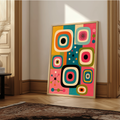  retro mid century modern atomic abstract art print. Features bold geometric television shapes, starbursts, and lines in bright pink, teal, orange, and olive green. Perfect vintage wall art poster for living rooms