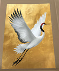 White red-crowned crane flying with wings spread wide against a textured gold background, Japanese crane art print.