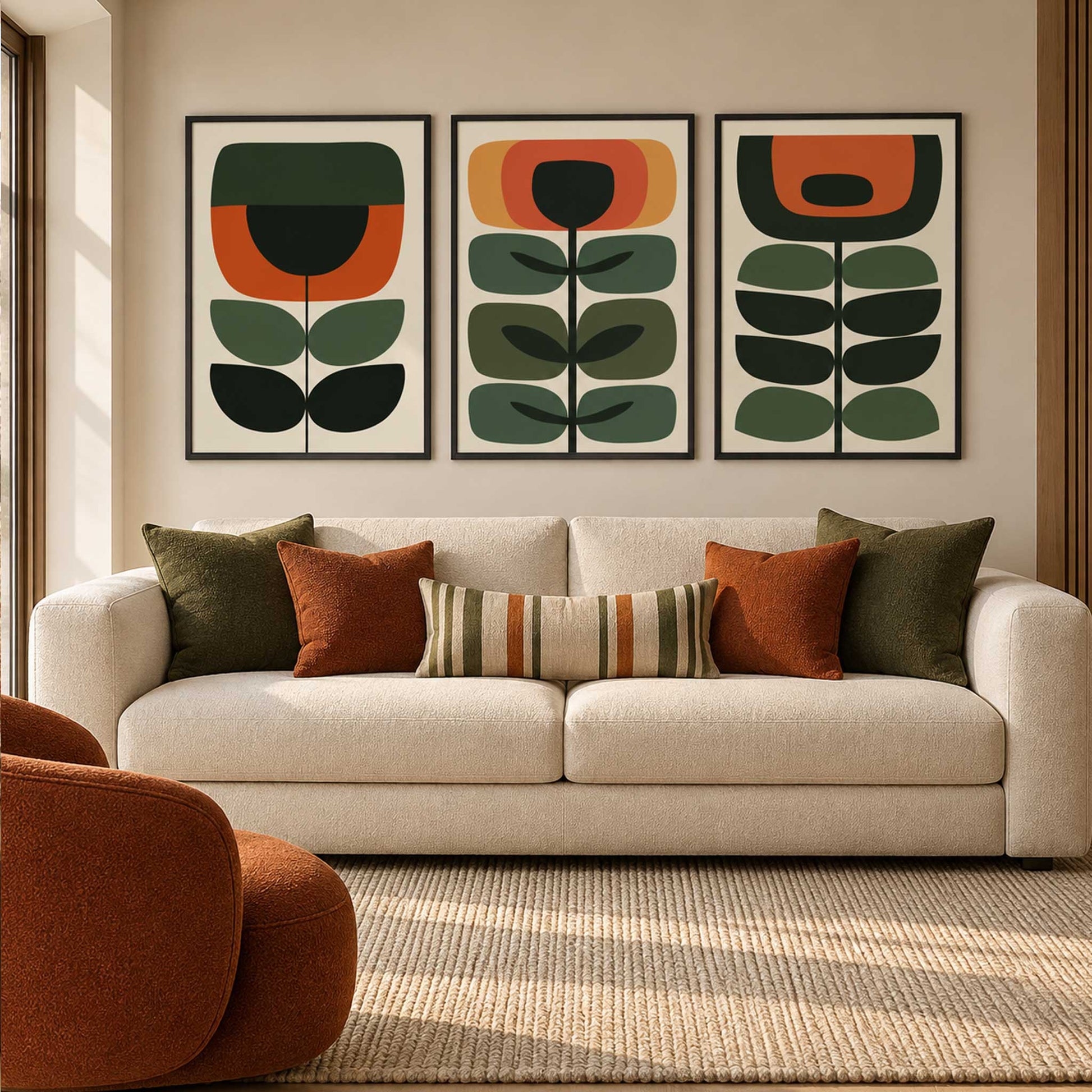 Mid century botanical wall art set of 3 with geometric green, burnt orange and ochre flowers and leaves on cream backgrounds.