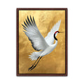 Flying white red-crowned crane canvas art with outstretched wings, black feather tips and textured gold background.
