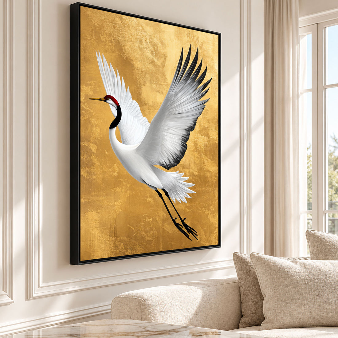 Large gold crane canvas wall art featuring a white bird in flight, displayed in a luxury cream living room.
