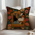 Floral folk art cat throw pillow with cats on a vintage armchair surrounded by colourful flowers